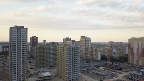 Aerial-view-of-the-area-with-new-residential-apartments-in-the-evening-at-sunset.-Cityscape.-The-construction-of-a-lot-of-apartment-buildings-reflects-urbanization-trends