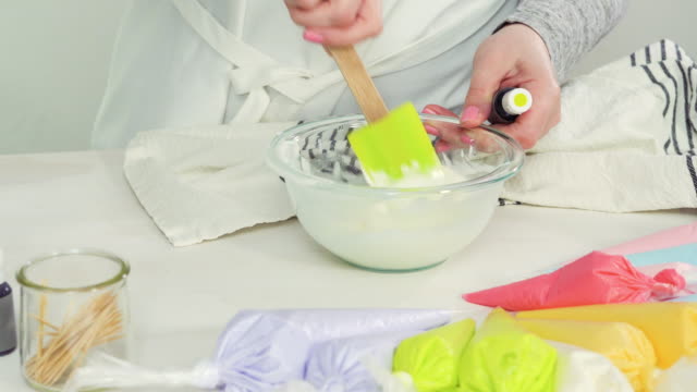Mixing-royal-icing-to-decorate-Easter-sugar-cookies