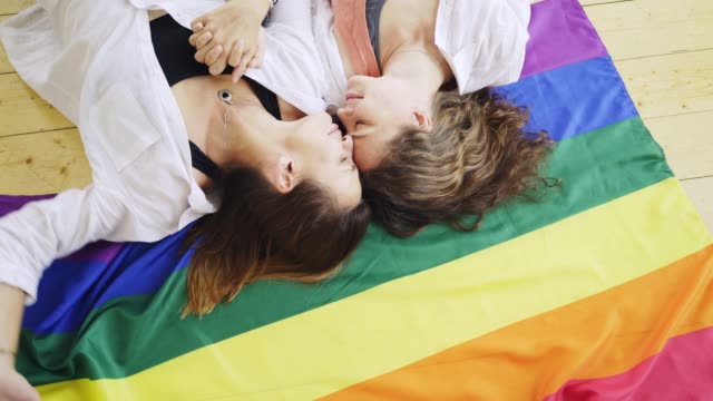 Girlfriend-lying-on-rainbow-flag