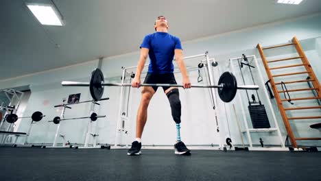 An-athlete-with-a-robotic-leg-during-lifting-a-bar