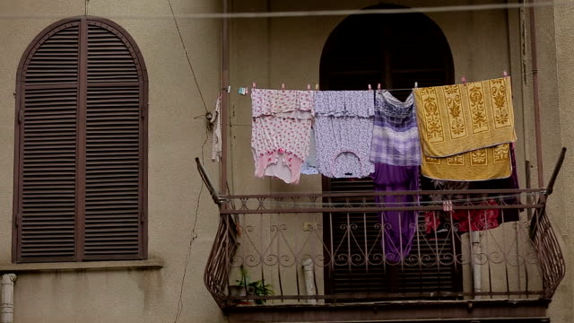 Cloth-drying-on-balconies,-poor-areas-of-the-city,-quiet-district,-homework