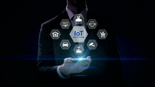 Businessman-using-mobile,-IoT-hexagon-icon,-Home-security,-cctv,-smart-city,-mobile-app,-car,-internet-of-thing.-4K-size-movie