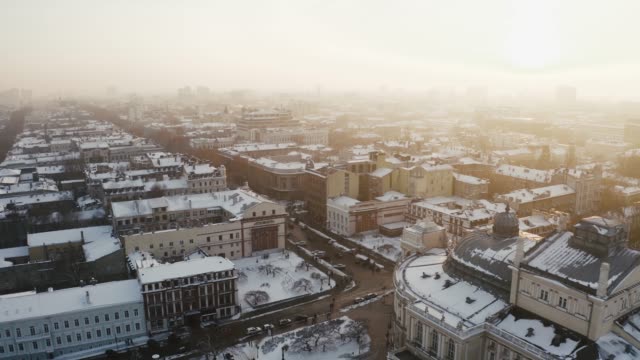 Cinematic-aerial-footage-of-old-city-center-and-opera-and-ballet-theatre-during-sunny-winter-day