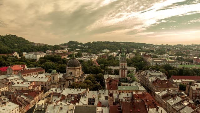 Time-lapse-of-moving-clouds-in-city-Lviv,-Ukraine.-View-from-the-highest-point-in-the-city-center.-Roofs-and-streets-Old-City-Lvov,-Ukraine.-Central-part-of-old-city.-European-City.-Densely-populated-areas-of-the-city.-Panorama-of-the-ancient-town