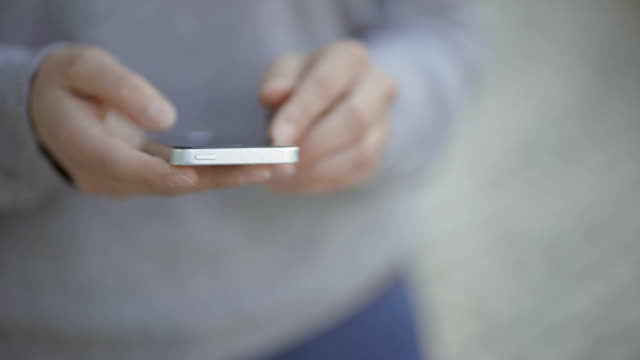 Closeup-shot-of-female-hands-using-smartphone.