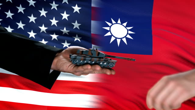 USA-and-Taiwan-officials-exchanging-tank-for-money,-global-arms,-flag-background