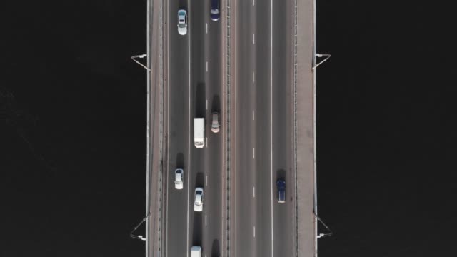 Highway-bridge-traffic-aerial-top-view-time-lapse-colorful-cars