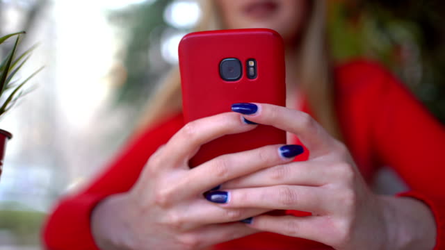 Close-up-of-woman-hand-using-mobile-phone