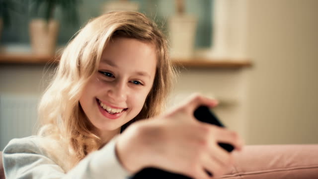 Girl-takes-self-portrait-using-new-app.-Selfie-snap-photo