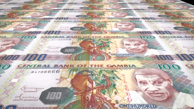 Banknotes-of-one-hundred-gambian-dalasis-of-Gambia-rolling,-cash-money,-loop