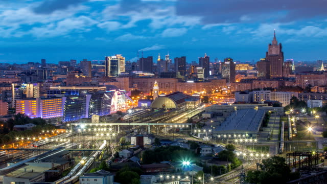 Panoramic-view-to-Kiev-Railway-Station-night-to-day-timelapse-and-modern-city-in-Moscow,-Russia
