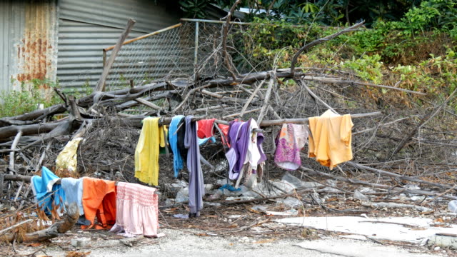 The-poor-dry-things-on-the-branches-on-trees.-Poor-homeless-people-dry-their-things-on-the-streets-of-the-city