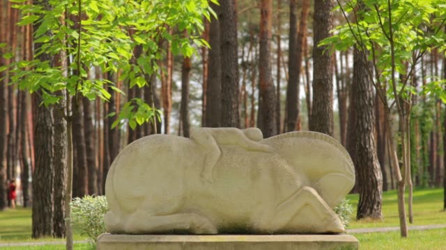 Man-Lies-on-Horse-Sculpture