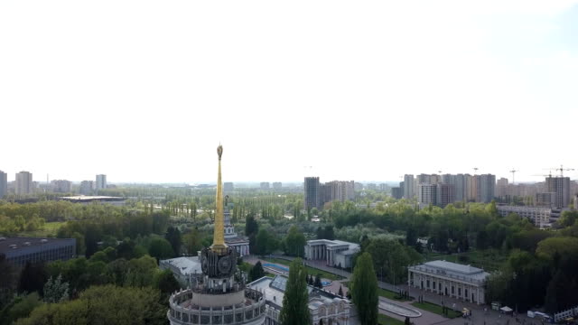 Panoramic-video-from-the-drone-to-the-National-Exhibition-Center-and-Kyiv-National-University-T.-Shevchenka,-Kyivskiy-Ipodrom-in-Kiev,-Ukraine.-Slow-motion-view-in-FullHD-high-resolution-video
