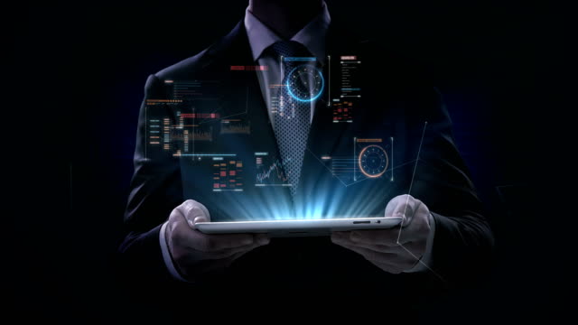 Businessman-lifting-tablet,-graphic-user-interface,-Futuristic-digital-display,-grow-artificial-intelligence.-4k-movie.2.