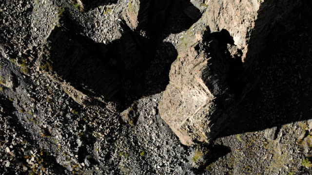 Aerial-view-of-structured-rocks-with-crumbling-debris.-Cellular-rocks.