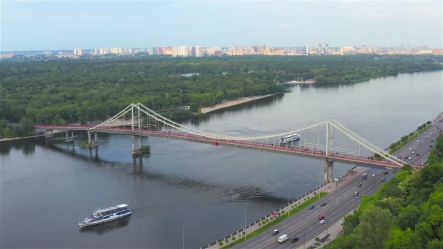 Aerial-view-of-the-Pedestrian-Bridge-and-the-Dnieper-River,-Kyiv