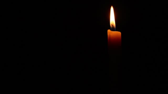 Simple-burning-candle-on-a-black-background.-full-HD-1920-X-1080