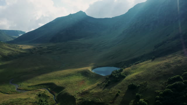 Aerial-view;-drone-moving-over-mountain-lake