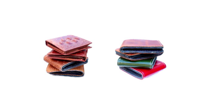 Group-wallet-of-leather-rotating-on-isolated