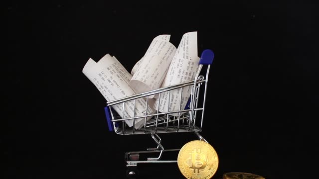 Receipts,-supermarket-shopping-trolley,-bitcoin-payment