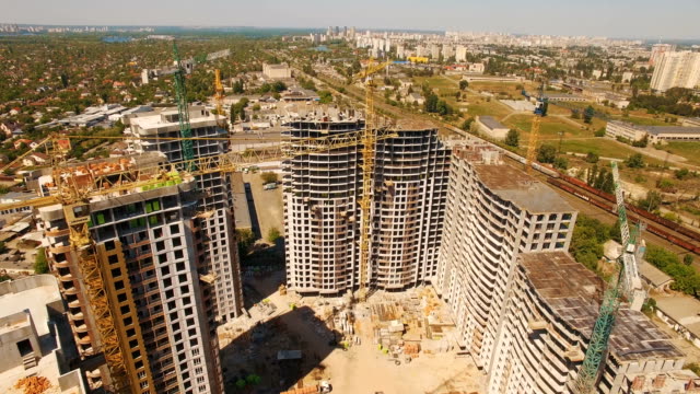 Aerial-shoot-of-construction-site-with-tower-cranes.-Drone-footage