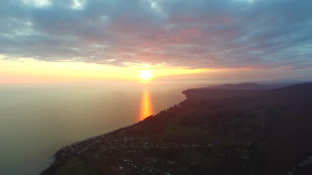 Aerial-view-of-sunset-over-New-Athos,-Abkhazia.