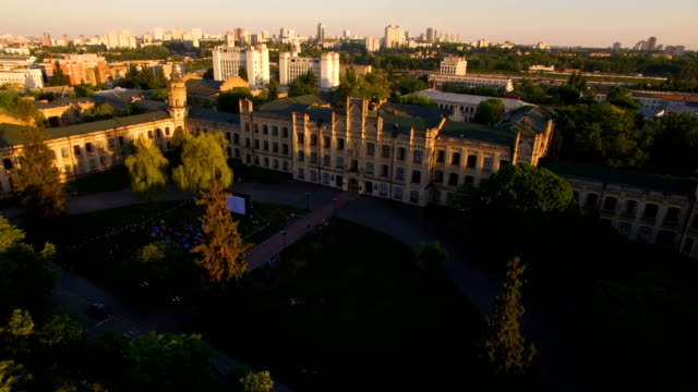 Old-colledge-on-the-background-of-the-city-at-sunset-aerial