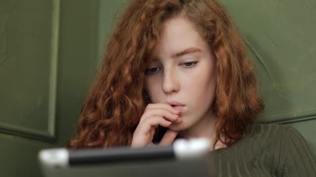 Close-up-Shot-of-Young-Girl-using-Tablet