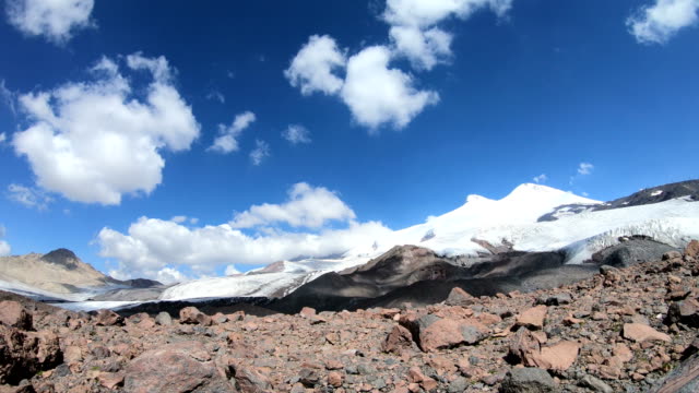 Time-lapse-of-the-foot-of-the-sleeping-Elbrus-volcano-with-snow-capped-peaks-of-the-sky-with-moving-shadows-and-clouds.-North-Caucasus.-Russia