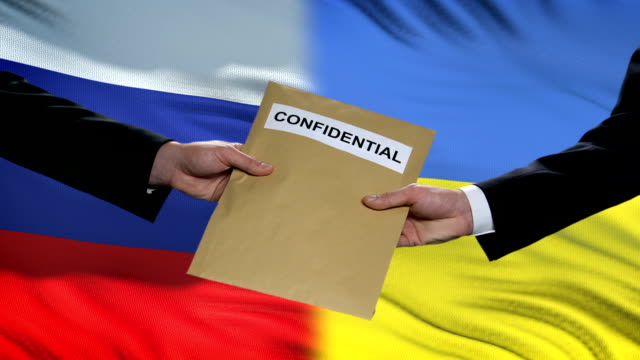 Russia-and-Ukraine-officials-exchanging-confidential-envelope,-flags-background