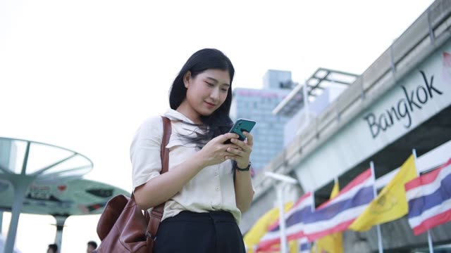 Asian-woman-using-mobile-phone