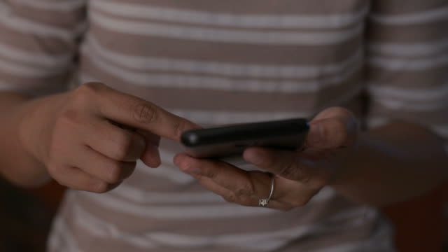 Close-up-woman-hands-using-mobile-smart-phone-for-communication.