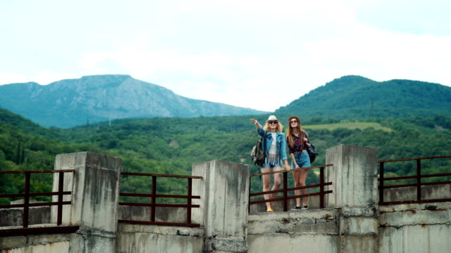 Two-friends-traveling-together,-they-were-in-a-stunningly-beautiful-location-in-the-mountains.
