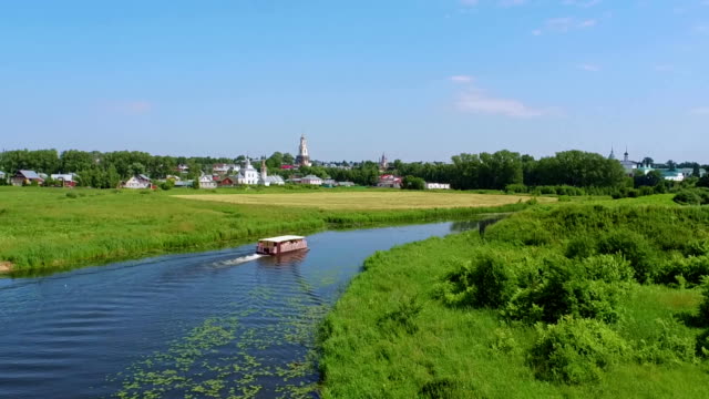 river-travel-in-Suzdal,-Russia,-aerial-shot