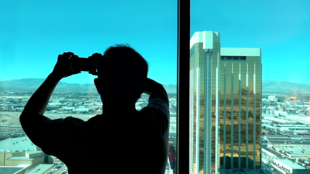Man-taking-picture-of-Las-Vegas-view-in-slow-motion-250fps