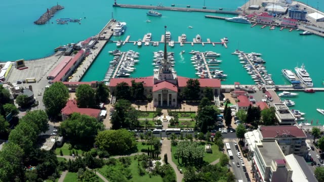 Aerial-video-shooting.-Panoramic-view-of-the-sea-port-of-Sochi,-Russia.-Luxury-yachts-and-boats-are-in-the-Bay.-The-view-from-the-top.-City-attraction.-Black-Sea.