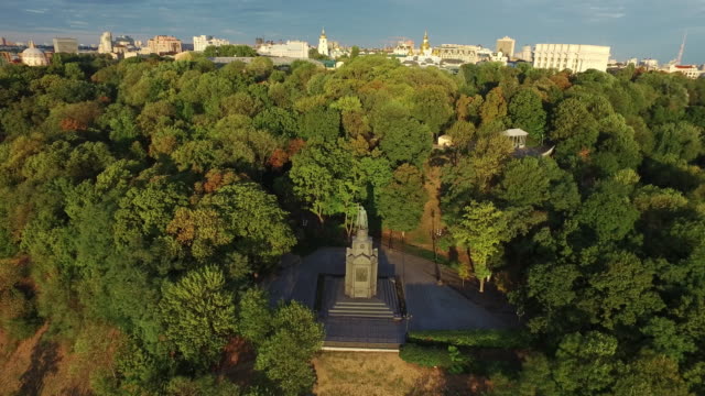 Aerial-view-monument-saint-Prince-Vladimir-with-cross-in-summer-park-Kiev-city