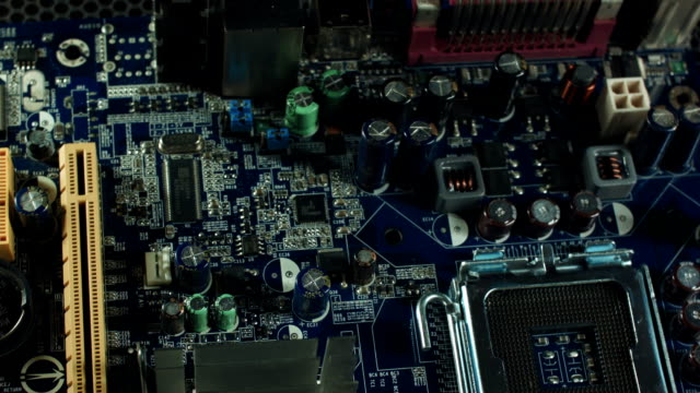 components-of-the-motherboard-closeup,-sata-slots-and-RAM,-heatsink-cooler