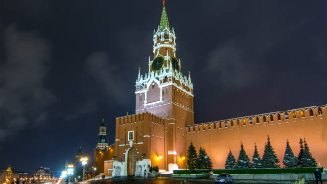 View-of-The-Saviour-Spasskaya-Tower-timelapse-hyperlapse-and-Kremlin-walls-of-Moscow-Kremlin,-Russia-at-night-in-winter