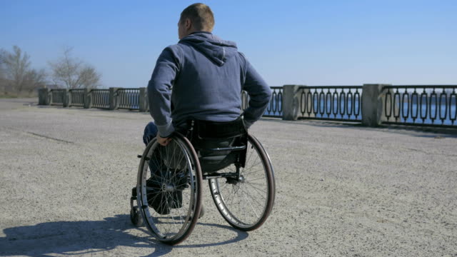 Tired-man-disability,-Wheelchair-wheels,-Difficulty-traveling-wheel-chair-on-street,-Disabled-man-in-wheelchair,-movement-people
