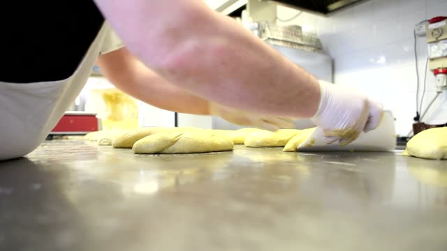 pastry-chef-hands-preparing-the-dough-for-Easter-cake-doves