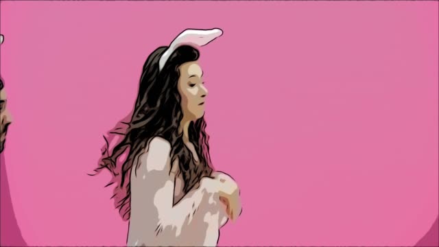 A-young-couple-of-lovers-appears-on-the-pink-background,-reproducing-jumping-hare.-With-the-ears-of-a-pink-rabbit-on-the-head.-Easter-Concept.-Animation.