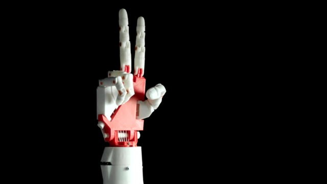 Robotic-programmed-prosthesis-hand-shows-rock-gesture-and-victory-sign-on-black-background