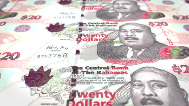 Billetes-de-veinte-dólares-de-Bahamas-en-pantalla,-dinero-en-efectivo,-lazo