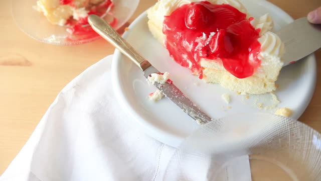 Man-serves-slice-of-strawberry-cake
