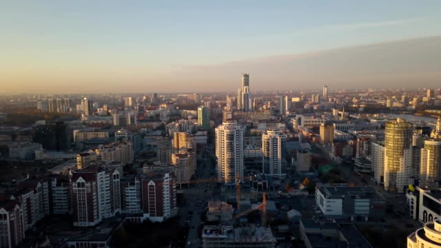 Sunset-in-megapolis.-Video.-Beautiful-cityscape-with-top-view-on-skyscrapers.-Top-view-of-the-modern-city-at-sunset