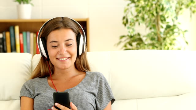 Girl-listening-to-music-selecting-song