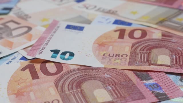 Money-and-business-success-background-made-of-Euro-banknotes-4K-2160p-30fps-tilting-UltraHD-video---Slow-tilt-over-European-currency-denominations-4K-3840X2160-UHD-footage