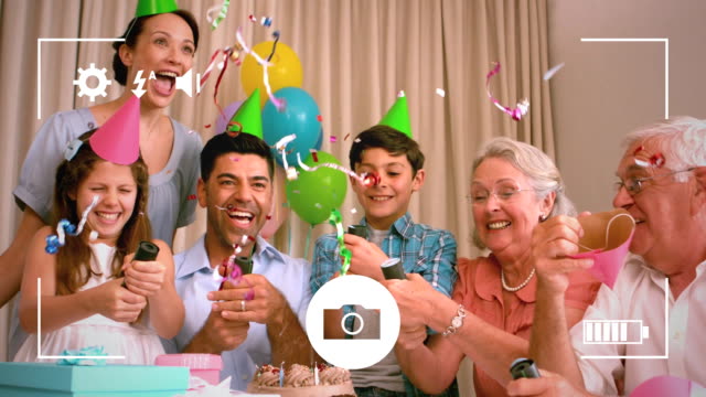 Taking-photos-of-family-at-birthday-party-on-a-digital-camera